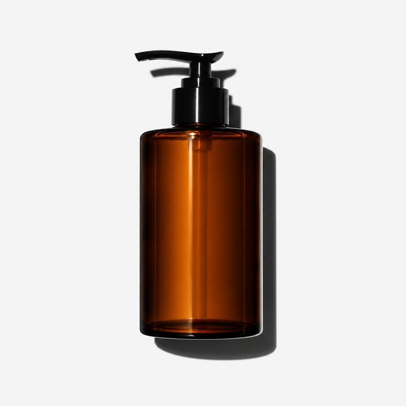 Pillow Mist on a nightstand beside a reading lamp.